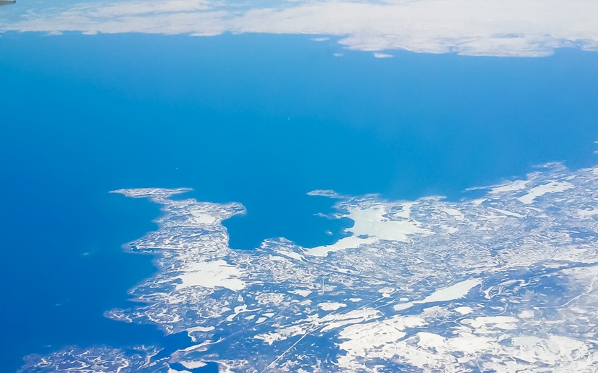 airplane wing above frozen land