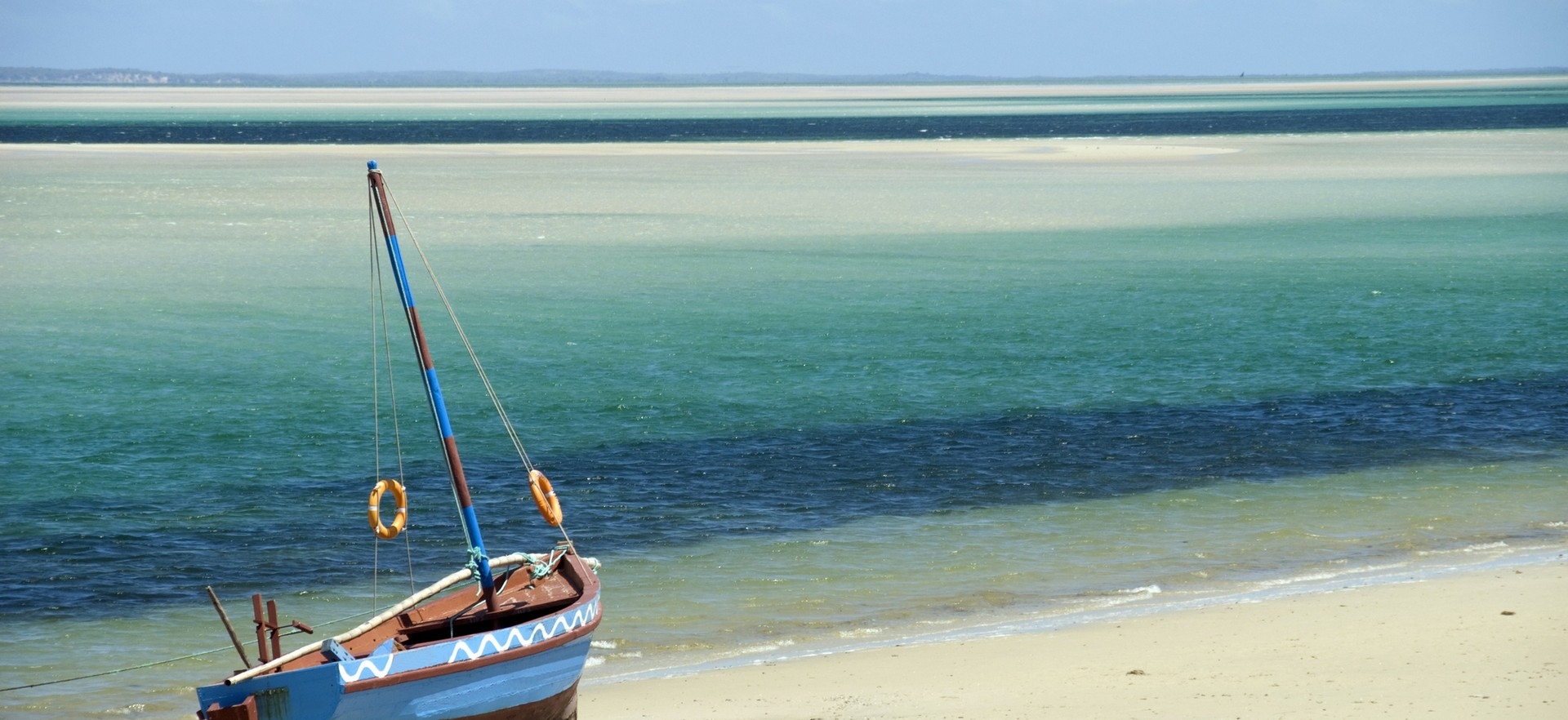 hero-boat-beach-shores-ocean-blue-mozambique